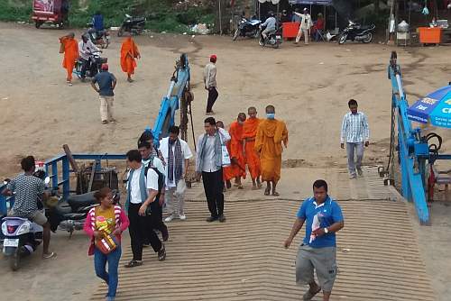 Priests and monks boarding a ferry